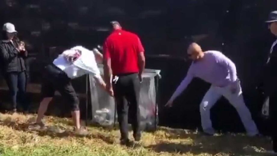 Homem do lixo... à procura da bola de Tiger Woods!