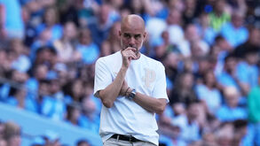 Manchester City's head coach Pep Guardiola watches from the sideline during a Premier League soccer match between Manchester City and