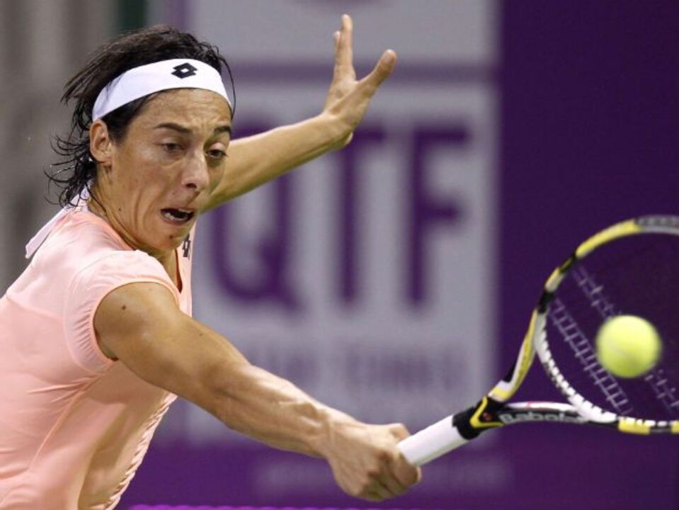 Schiavone triunfa no adeus a Doha