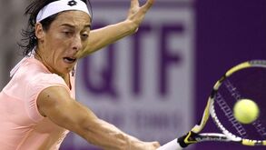Schiavone triunfa no adeus a Doha