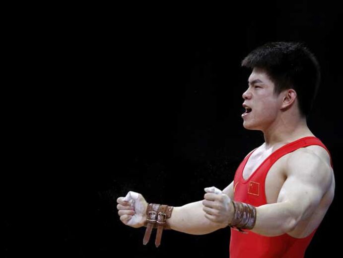 Chinês Qingfeng Lin conquista ouro em -69kg
