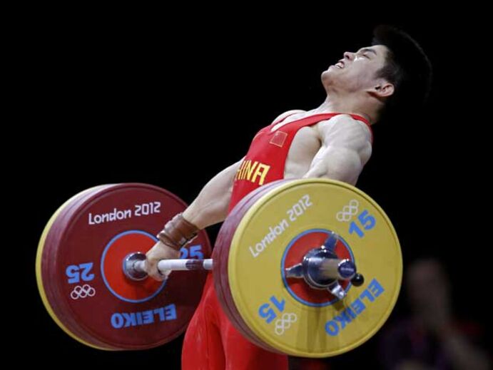 Chinês Qingfeng Lin conquista ouro em -69kg