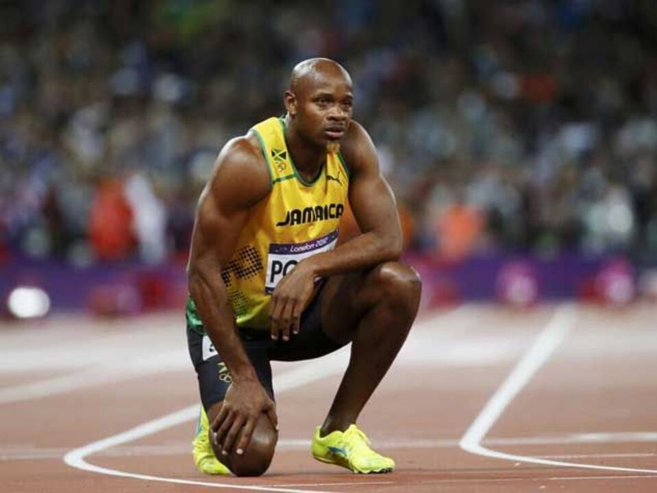 Asafa Powell falha 4x100 metros