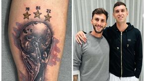 Defesas que valem títulos... e tatuagens: Emiliano Martínez eterniza troféu de campeão do Mundo na perna