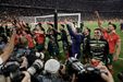Jogadores de Portugal celebram no campo após um jogo