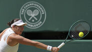 Amanda Anisimova compete em Wimbledon contra Iga Swiatek