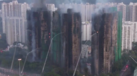 Imagens aéreas mostram arranha-céus destruídos pelo fogo em Hong Kong 