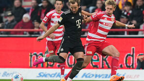 Kane marca nos descontos em Berlim e evita derrota do Bayern