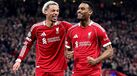Jogadores do Liverpool celebram nos oitavos de final da Liga dos Campeões