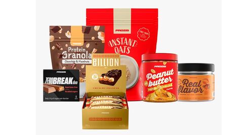 Variedade de produtos Prozis: waffles, proteína, aveia, creatina, manteiga de amendoim e brownie