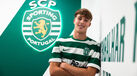Francisco Simões posa junto ao símbolo do clube