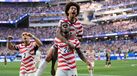 Jogadores dos Estados Unidos fazem a festa diante do Paraguai