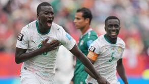 Jogadores do Senegal festejam frente ao Iraque