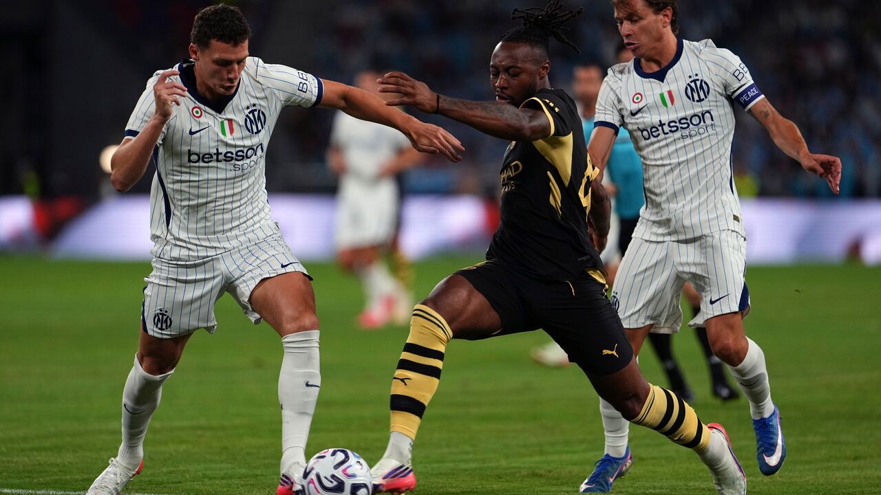 Manchester City's Antoine Semenyo tries to get past Inter Milan's players during a pre-season friendly match for the Hong Kong