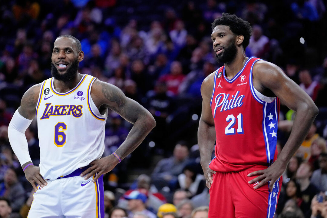 Los Angeles Lakers' LeBron James and Philadelphia 76ers' Joel Embiid play during an NBA basketball game, Friday, Dec. 9, 2022,