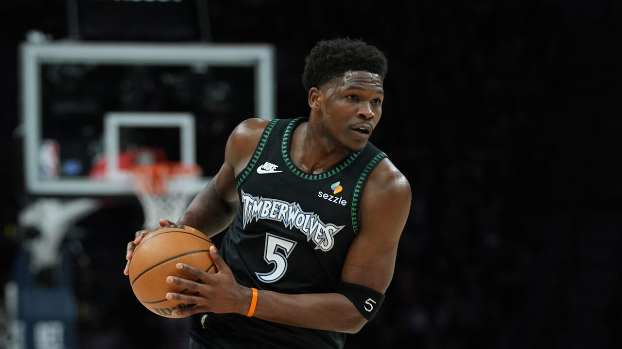 Minnesota Timberwolves guard Anthony Edwards (5) handles the ball during the first half of Game 4 of a NBA basketball
