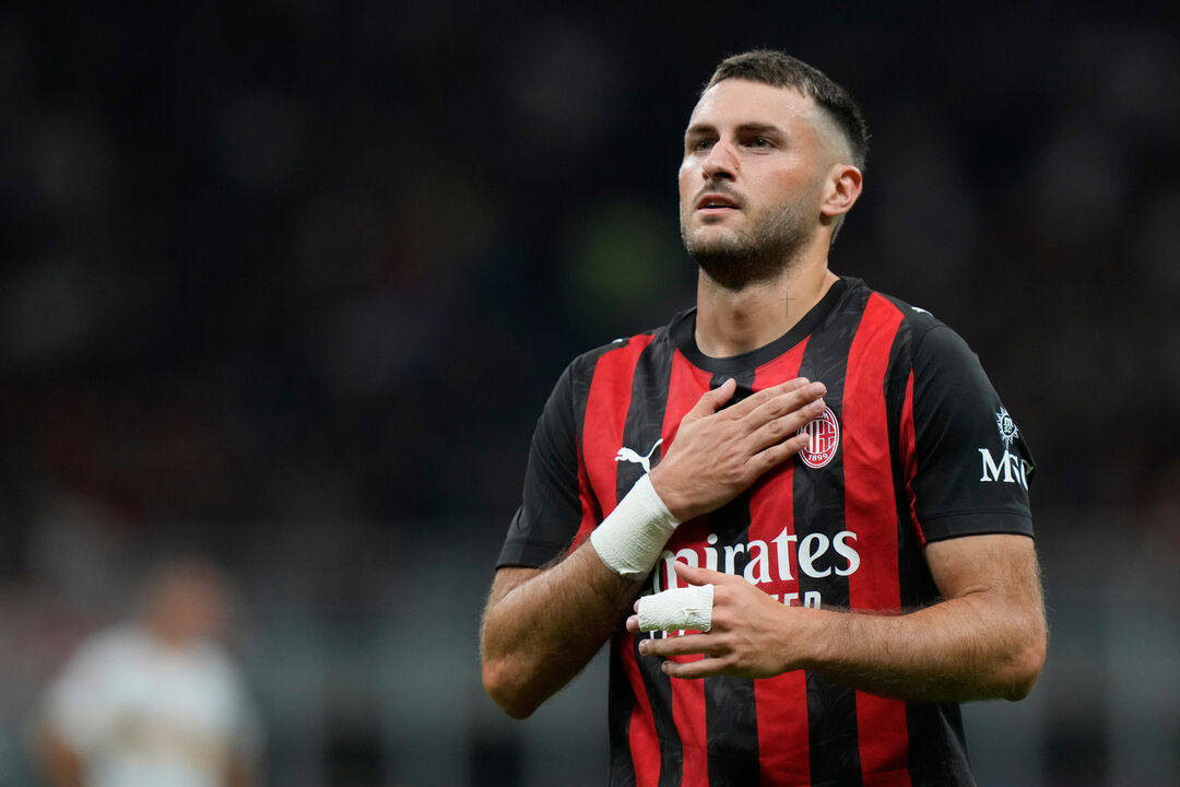 AC Milan's Santiago Gimenez celebrates after scoring against Lecce during an Italian Cup qualifying soccer match between AC Milan and