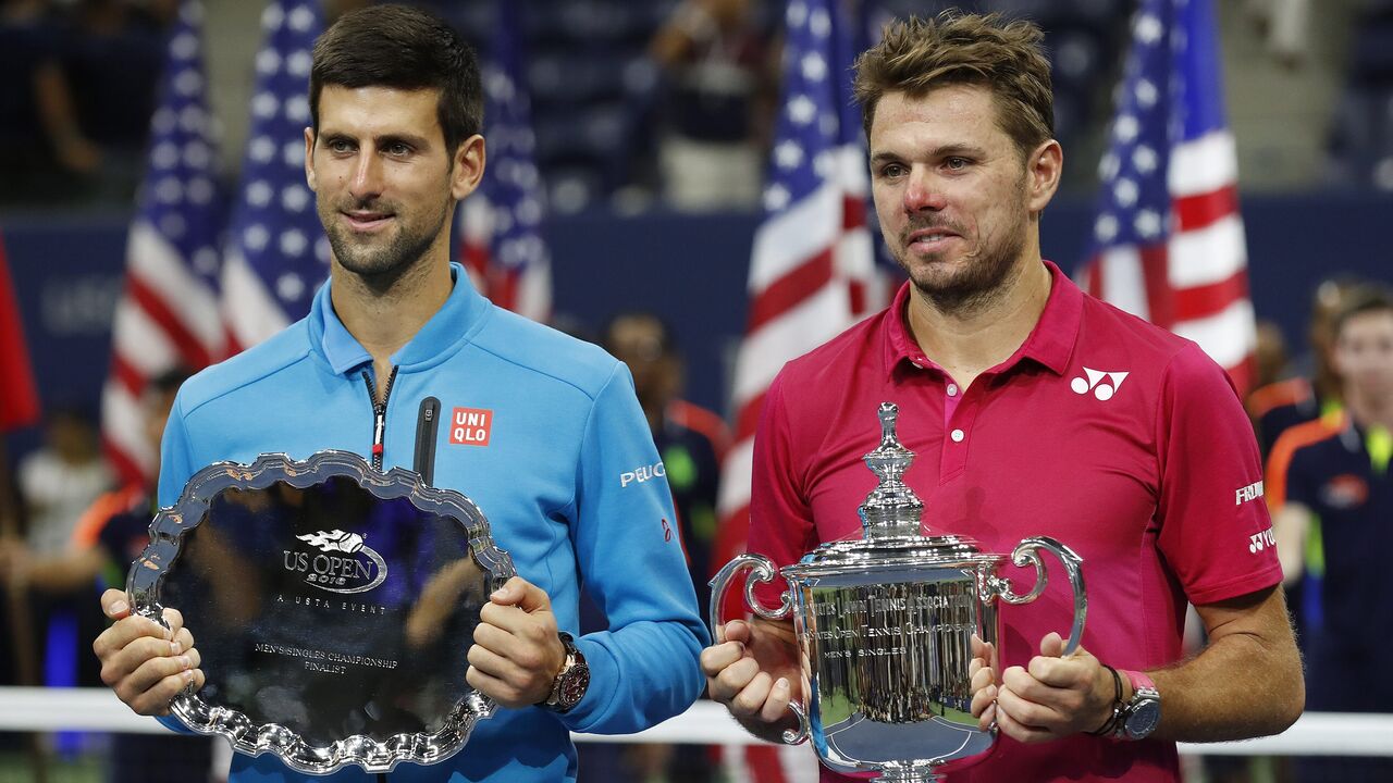 Stan Wawrinka e Novak Djokovic com troféus no US Open