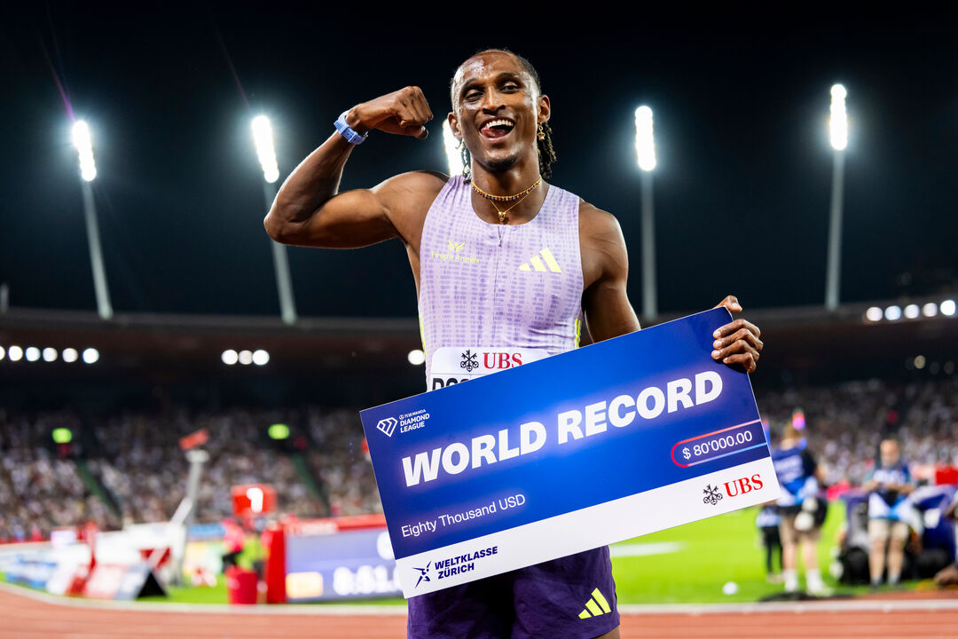 Brazil's Alison dos Santos celebrates winning the men's 400-meter hurdles, setting a new world record, at the Diamond League athletics