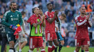 Jogadores do Liverpool reagem após o empate diante do Newcastle