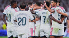 Real Madrid players celebrate after the first goal during the La Liga soccer match between Real Madrid and Real Sociedad
