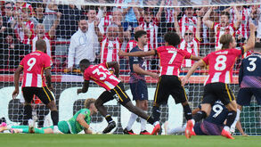 Brentford's Michael Kayode (33) celebrates after scoring his side's third goal during the English Premier League soccer match between Brentford