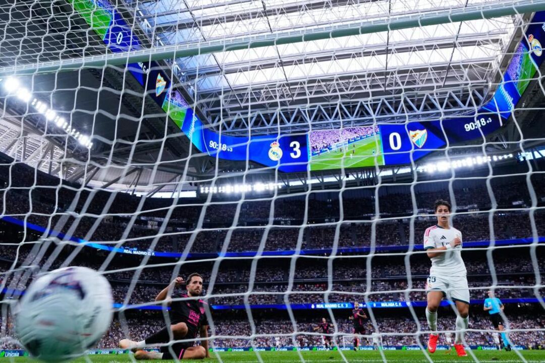 Real Madrid's Arda Guler, right, scores his sides fourth goal