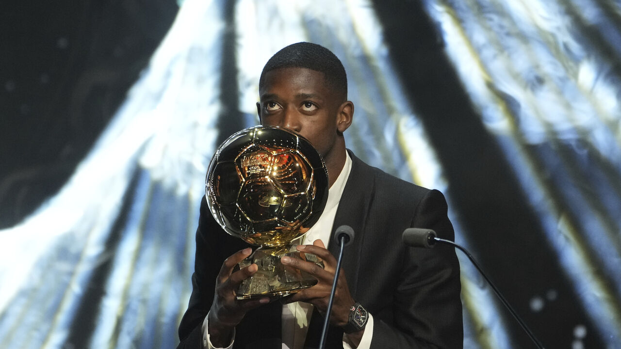 Paris Saint-Germain's Ousmane Dembélé receives the 2025 Men's Ballon d'Or during the 69th Ballon d'Or awards ceremony at the Theatre