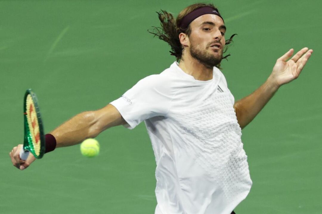 Stefanos Tsitsipas, of Greece, returns the ball to Ben Shelton,