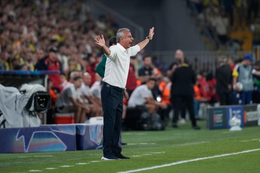Fenerbahce's head coach Ismail Kartal gives instructions from the side