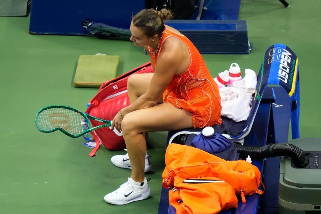 Aryna Sabalenka, of Belarus, smashes her racket after losing the