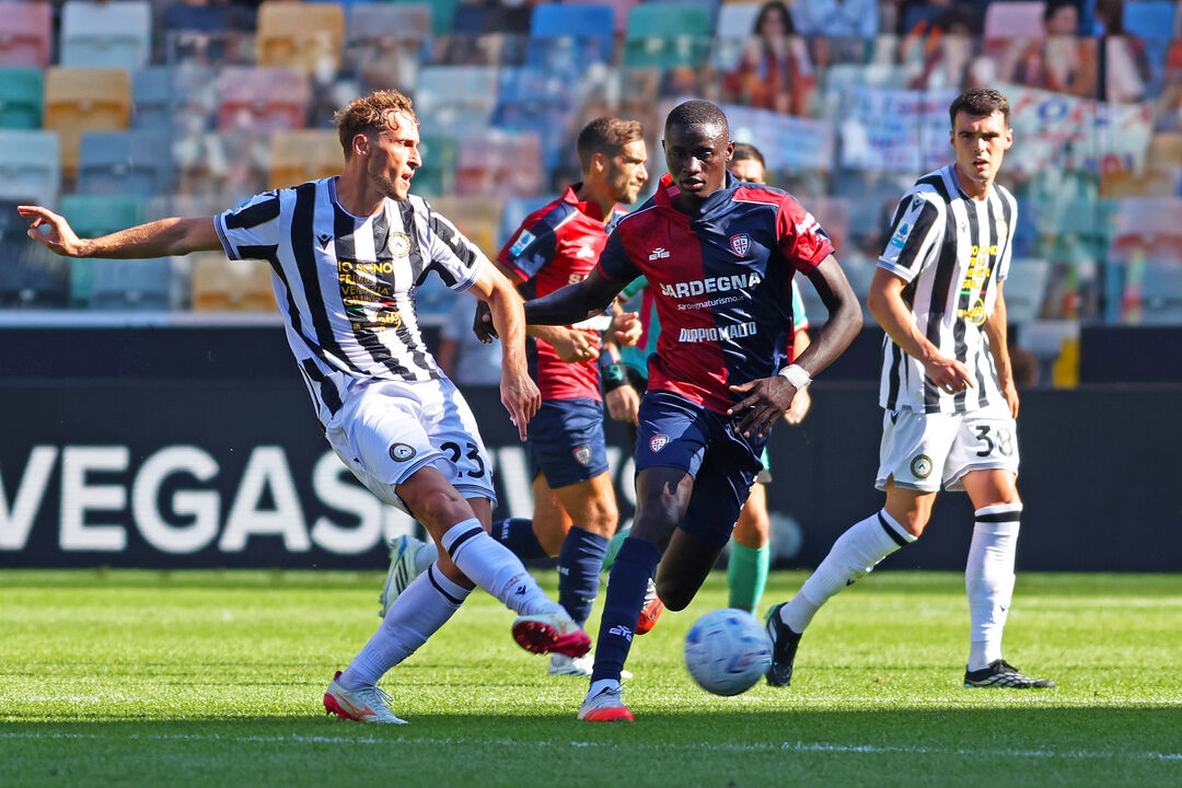 Udinese's Mergim Vojvoda, left, and Cagliari's Paul Mendy in action during the Serie A soccer match between Udinese and Cagliari