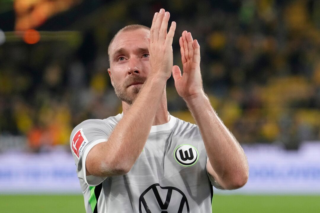 FILE - Wolfsburg's Christian Eriksen applauds to supporters at the end of the German Bundesliga soccer match between Borussia Dortmund