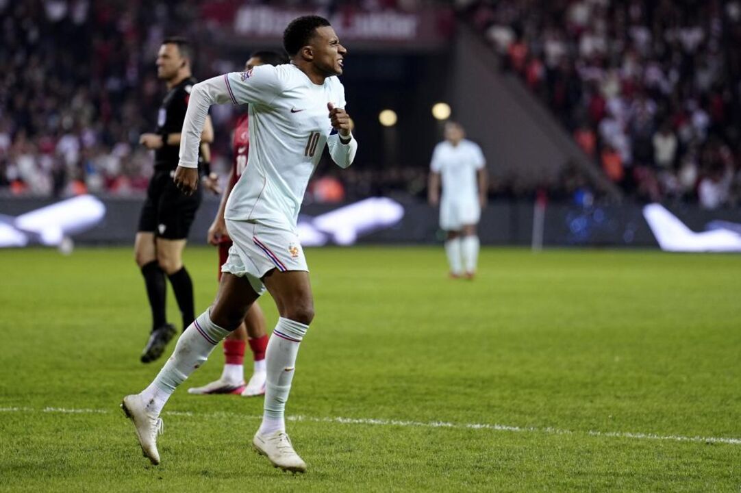 Kylian Mbappe of France limps after scoring the 0-1 opening