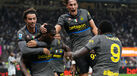 Inter Milan's Ange-Yoan Bonny, center, celebrates with teammates after scoring his sides fifth goal during the Serie A soccer match