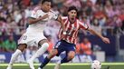 Real Madrid's Kylian Mbappe, left, vies for the ball with