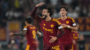 Roma's Mario Hermoso celebrates after scoring his side's first goal during the Serie A soccer match between Roma and Atalanta,