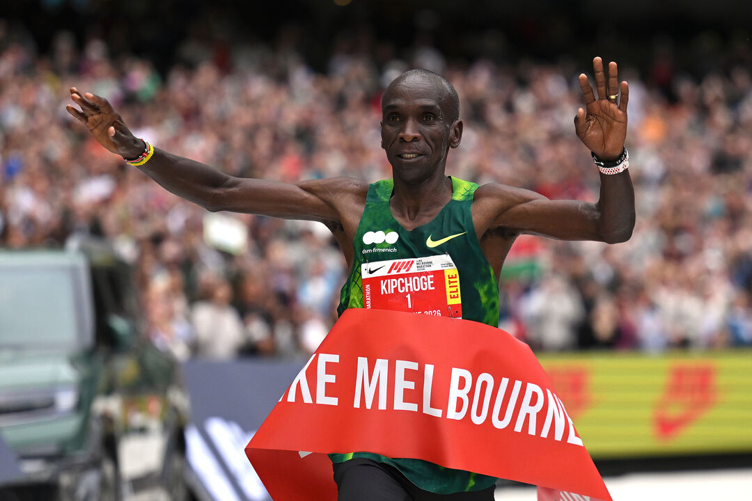 Eliud Kipchoge, of Kenya, crosses the finish line to win the men's category during the Melbourne Marathon in Melbourne, Australia,