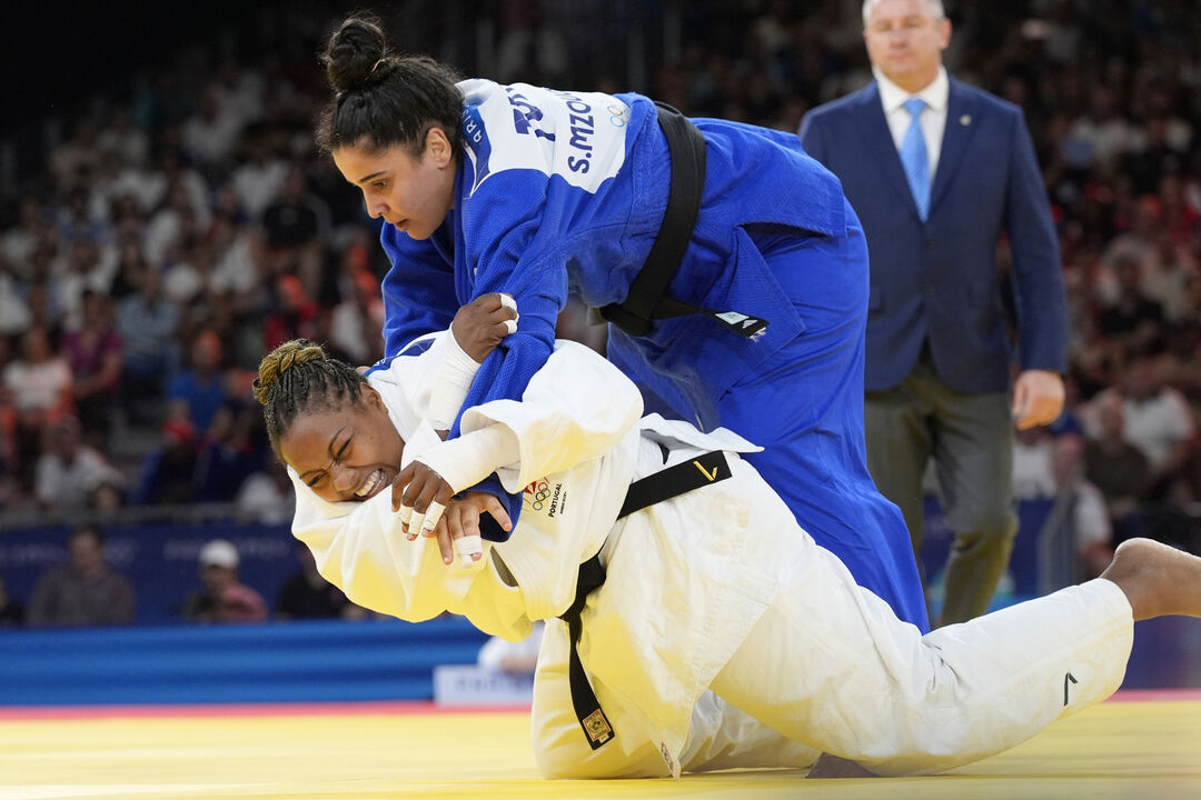 Portugal's Rochele Nunes and Tunisia's Sarra Mzougui compete during their women's +78 kg elimination round match in the team judo