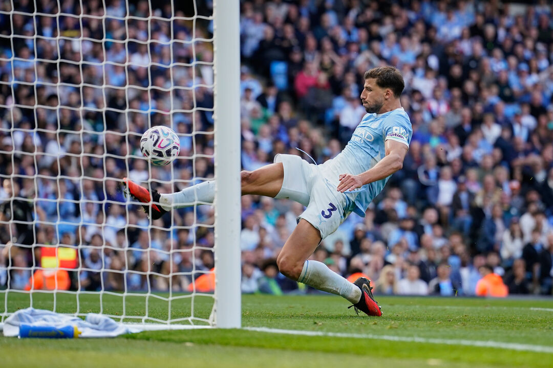 Manchester City's Ruben Dias clears the ball from the goal during the English Premier League soccer match between Manchester City