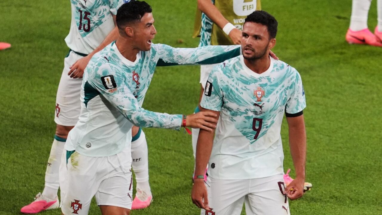 Portugal's Goncalo Ramos (9) is congratulated by Cristiano Ronaldo after