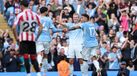 Erling Haaland (C) of Manchester City celebrates scoring the 5-3