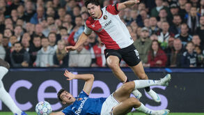Como's Jacobo Ramon tackles Feyenoord's Nacho Ferri during the UEFA Champions League soccer match betweem Feyenoord and Como in Rotterdam,